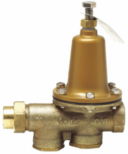A brass valve with the word out on it