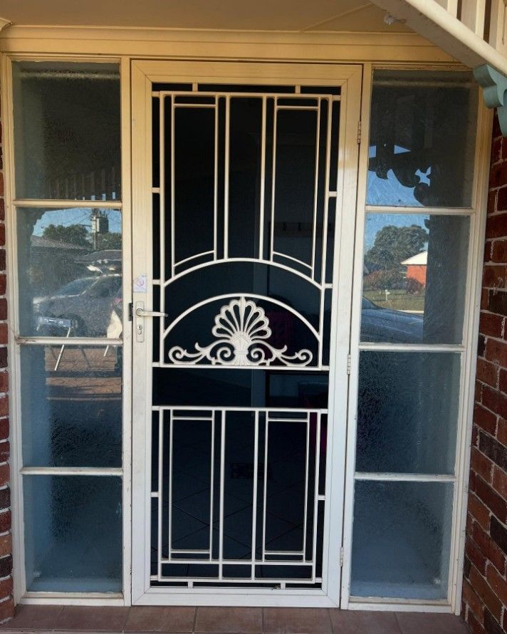 A White Door With a Fancy Design on It — JOA - Construction & Maintenance Pty Ltd in Wollongong, NSW