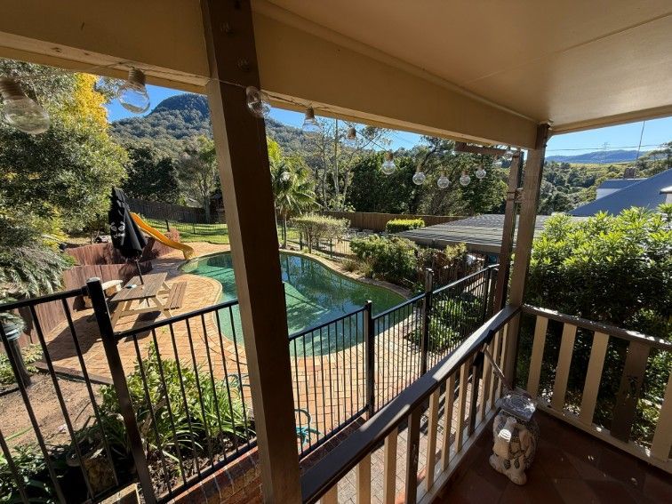 A View of a Swimming Pool From a Balcony — JOA - Construction & Maintenance Pty Ltd in Appin, NSW