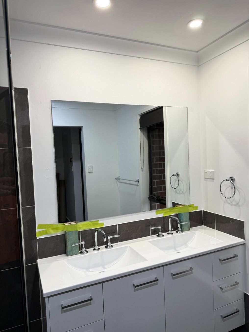 A Bathroom With Two Sinks and a Large Mirror — JOA - Construction & Maintenance Pty Ltd in Appin, NSW