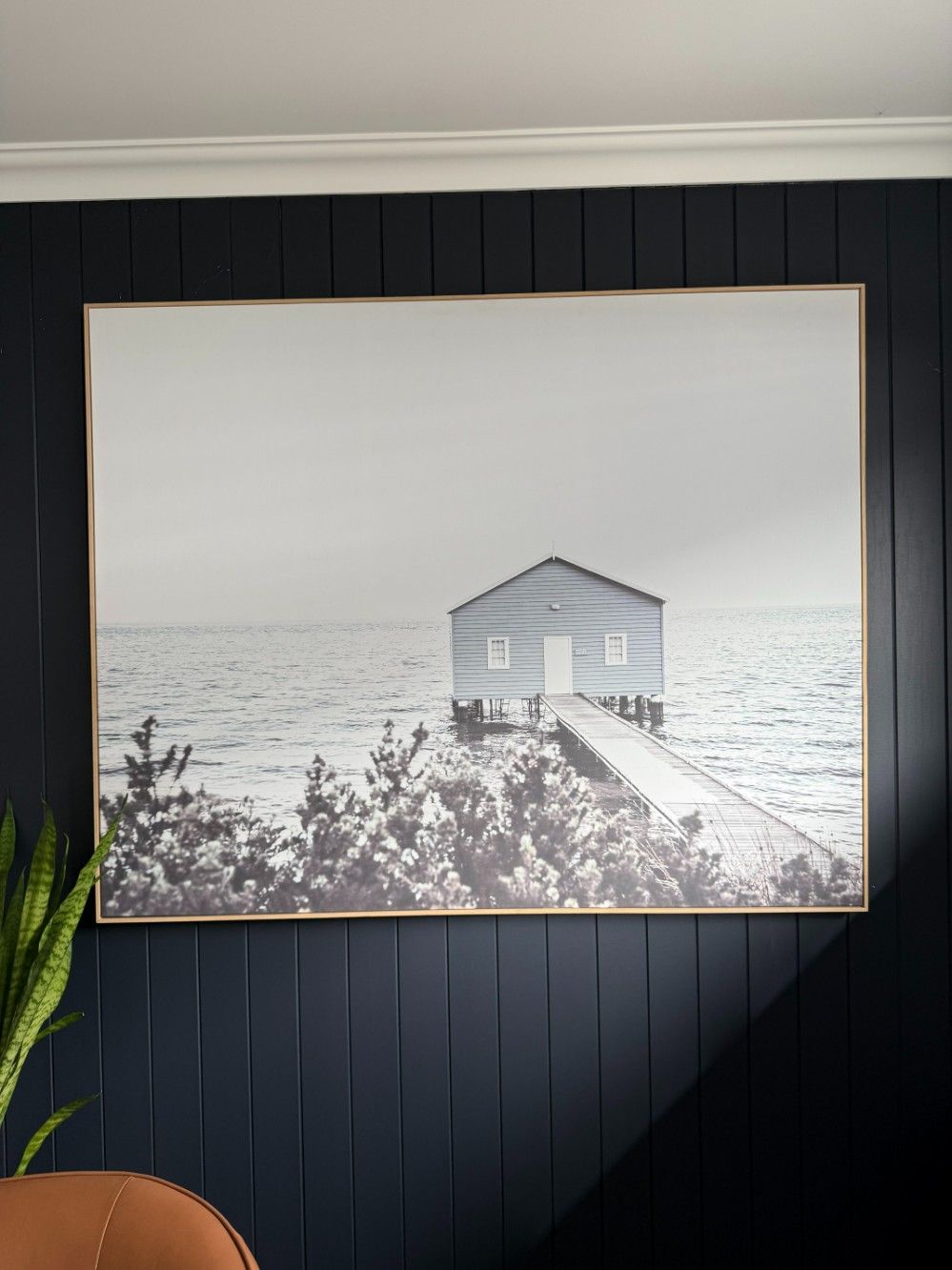 A Black and White Photo of a House on a Dock in the Ocean — JOA - Construction & Maintenance Pty Ltd in Appin, NSW