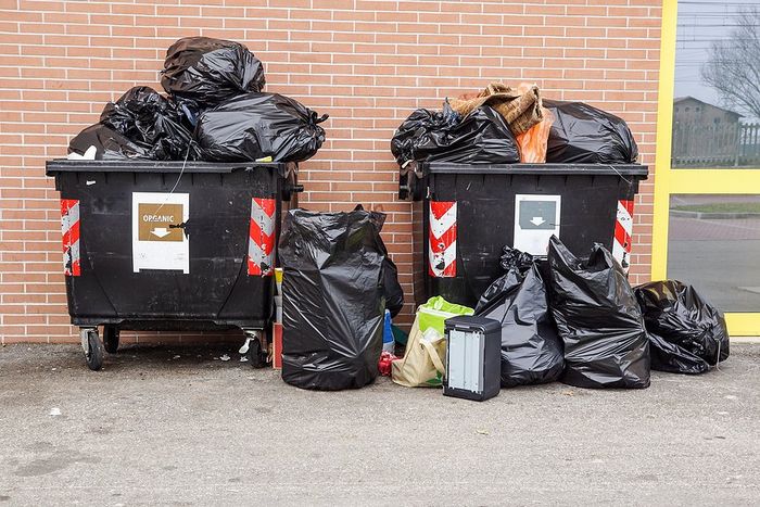 black bags in the dumpster