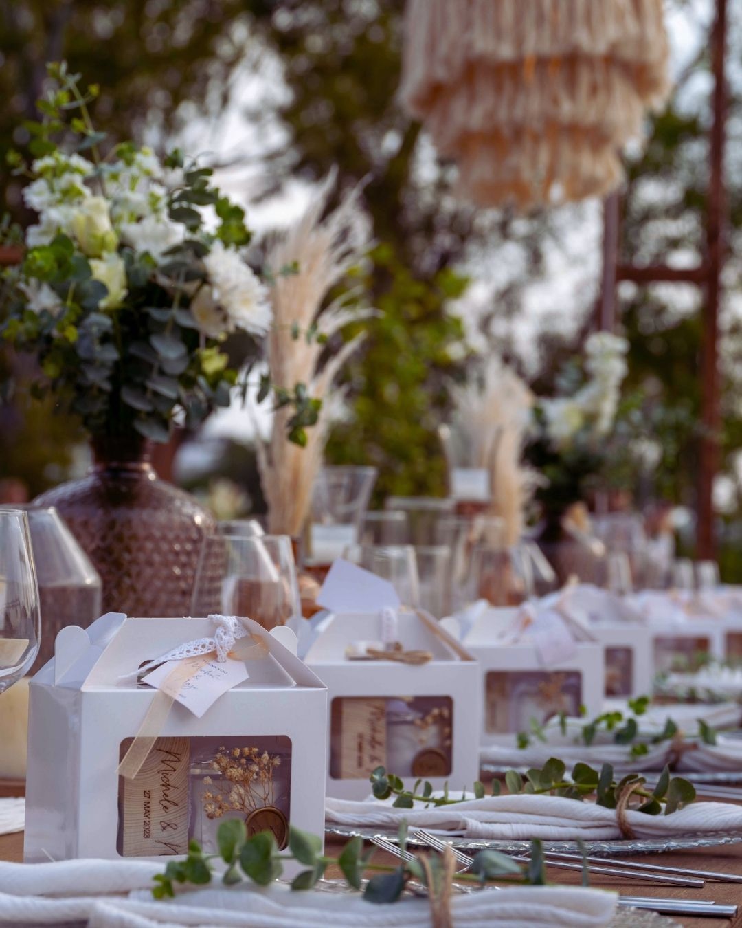 Elemanta Boutique Hotel | Elegant outdoor dining table with white floral centerpieces, table settings
