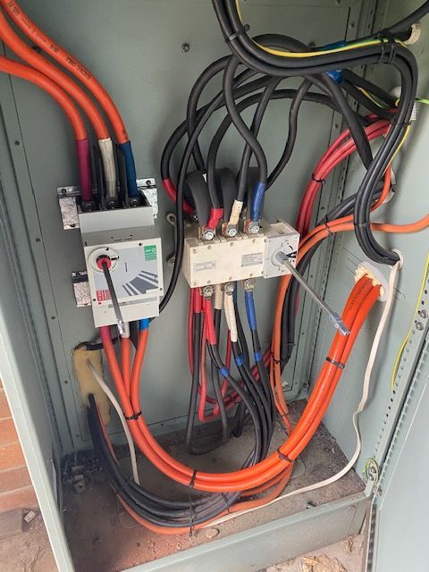 Electrical Panel With Orange and Black Cables — MAE Refrigeration In Portsmith, QLD