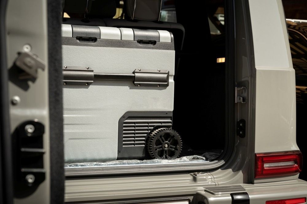 Gray Cooler with Wheels in The Open Back of A Gray Suv — MAE Refrigeration In Innisfail, QLD
