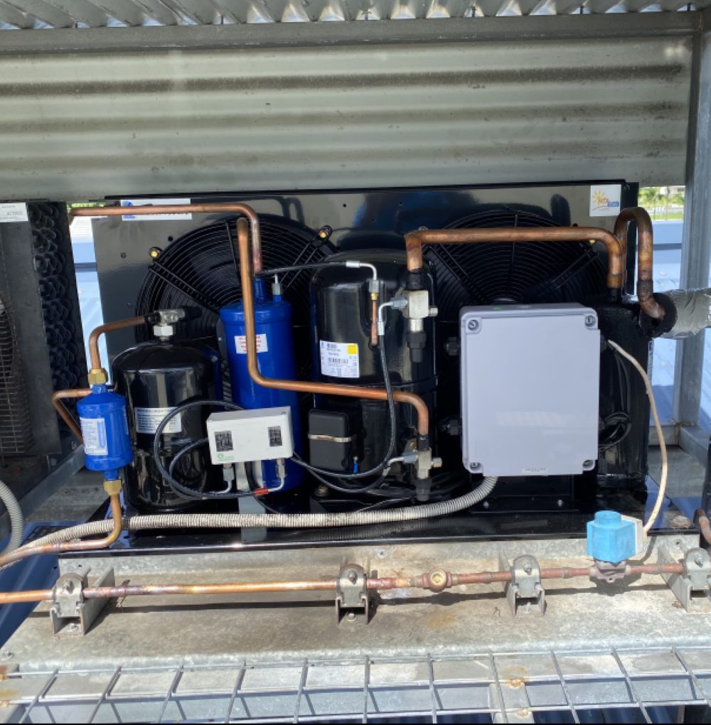 Refrigeration Unit with Copper Pipes, Black Compressor, Blue Filter — MAE Refrigeration In Portsmith, QLD