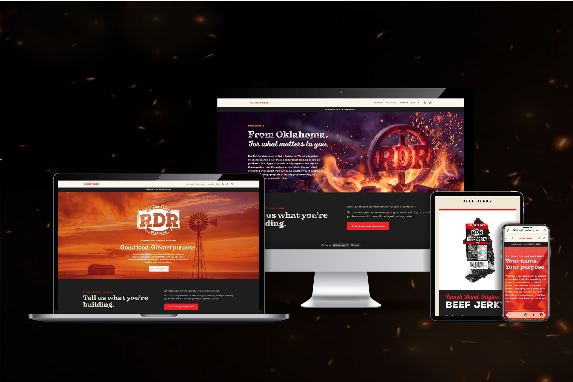 Responsive website mockups on desktop, laptop, tablet, and phone with dark, fiery orange theme