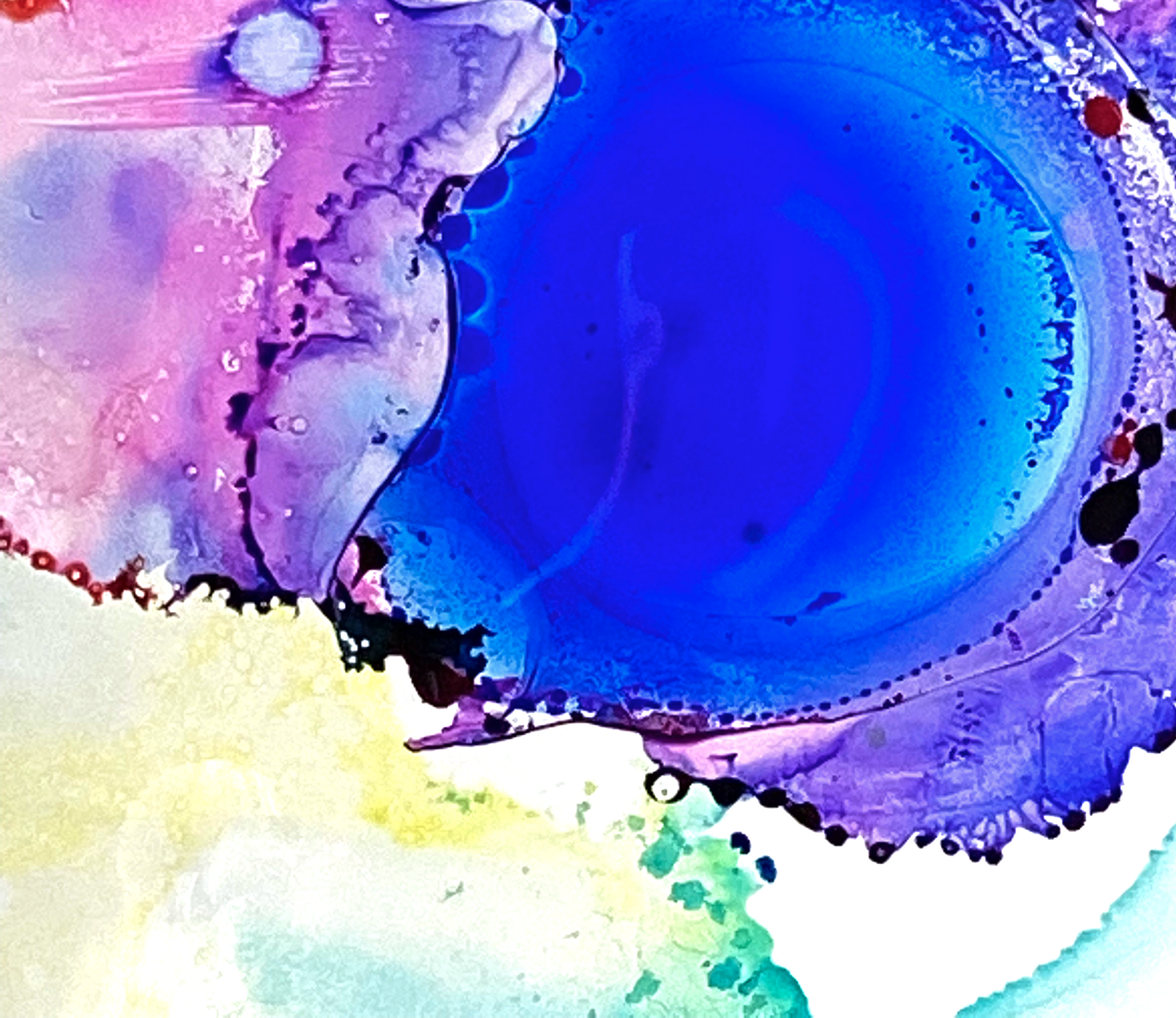 Abstract blue, purple, and pink watercolor circles and splashes on a white background