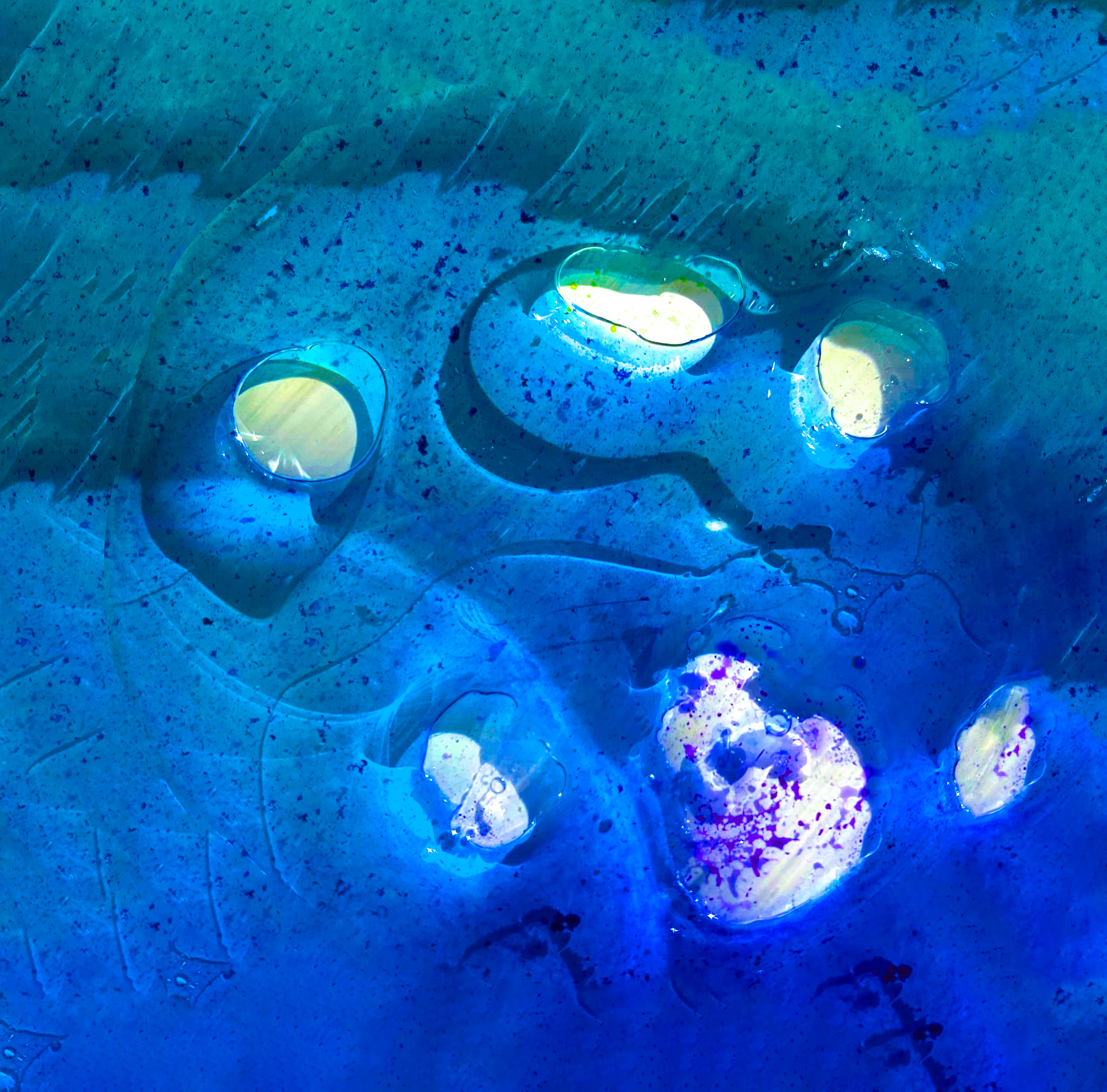 Blue abstract painting with glowing white and yellow circular shapes on a textured background