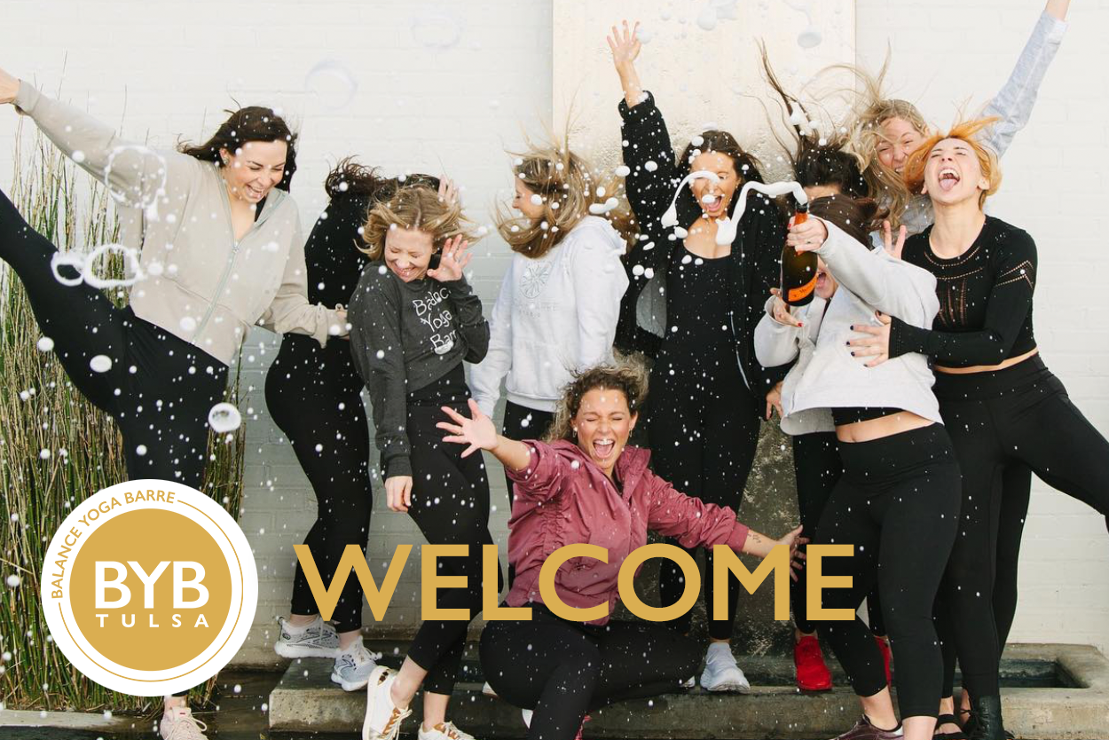 A group celebrates in a room with confetti, with the