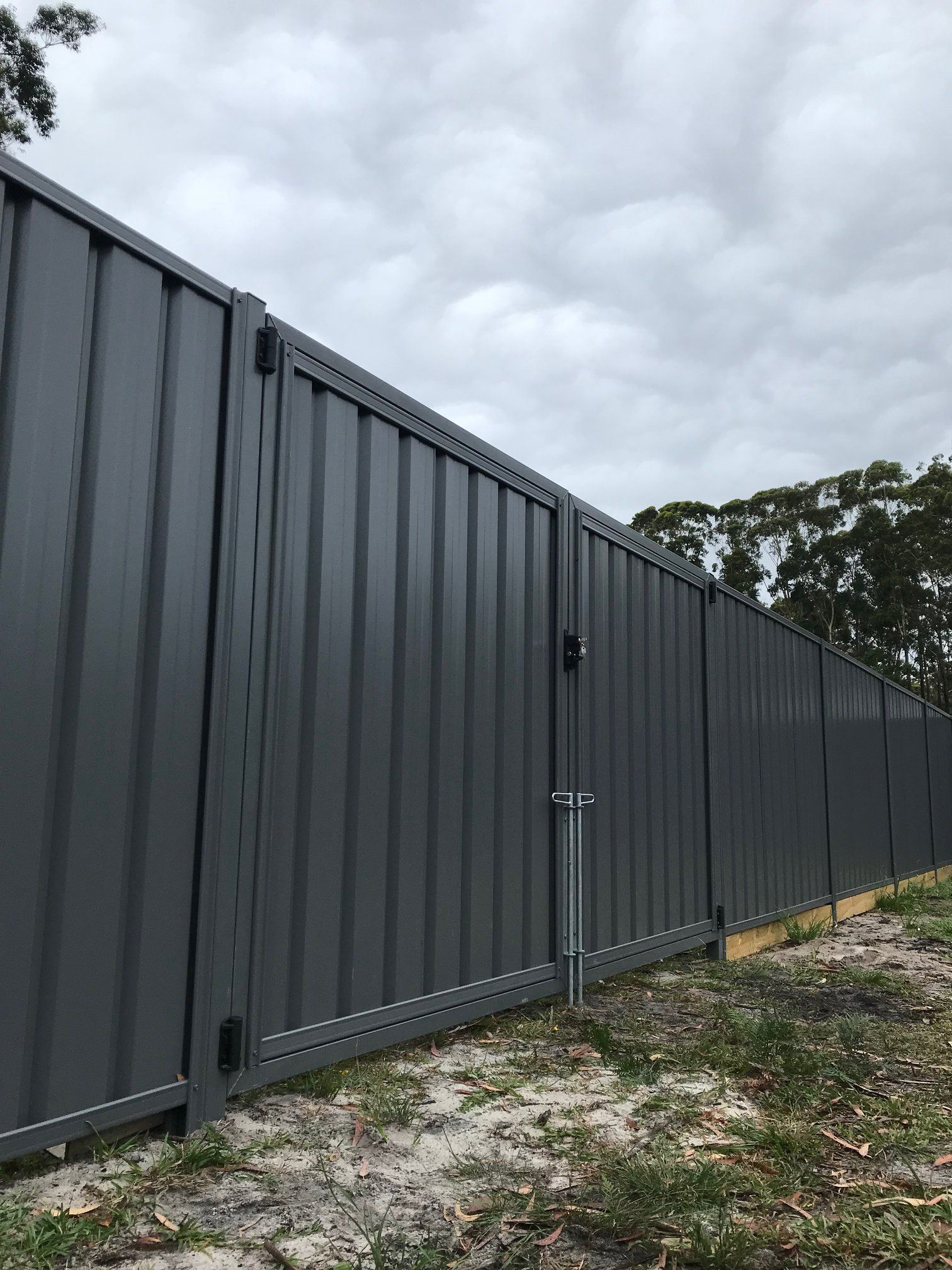 A Fence Along a Sidewalk Next to a House — Aztech Fencing In Upsalls Creek, NSW