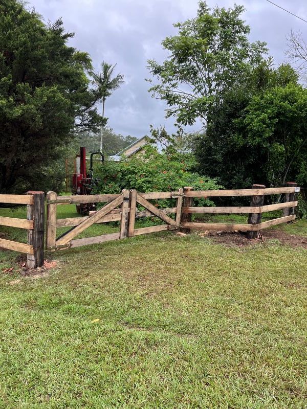 A Wooden Fence is in the Middle of a Grassy Field — Aztech Fencing In Upsalls Creek, NSW