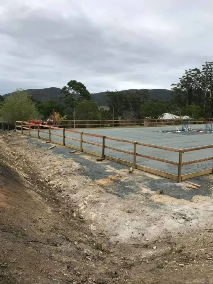 A Wooden Fence is Surrounding a Dirt Field — Aztech Fencing In Upsalls Creek, NSW