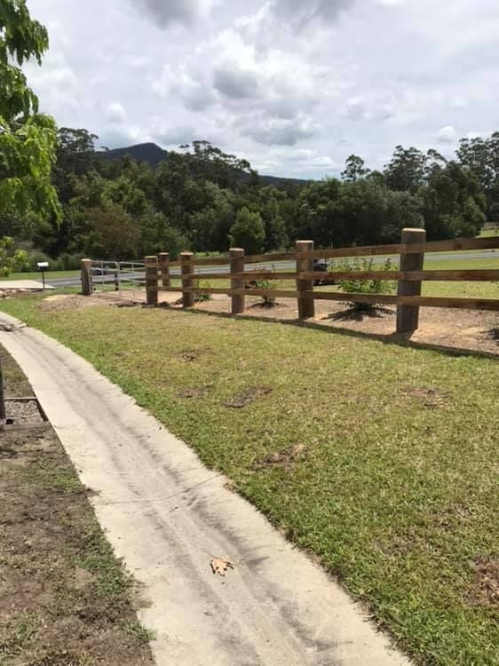 A Wooden Fence Surrounds a Green Field — Aztech Fencing In Upsalls Creek, NSW