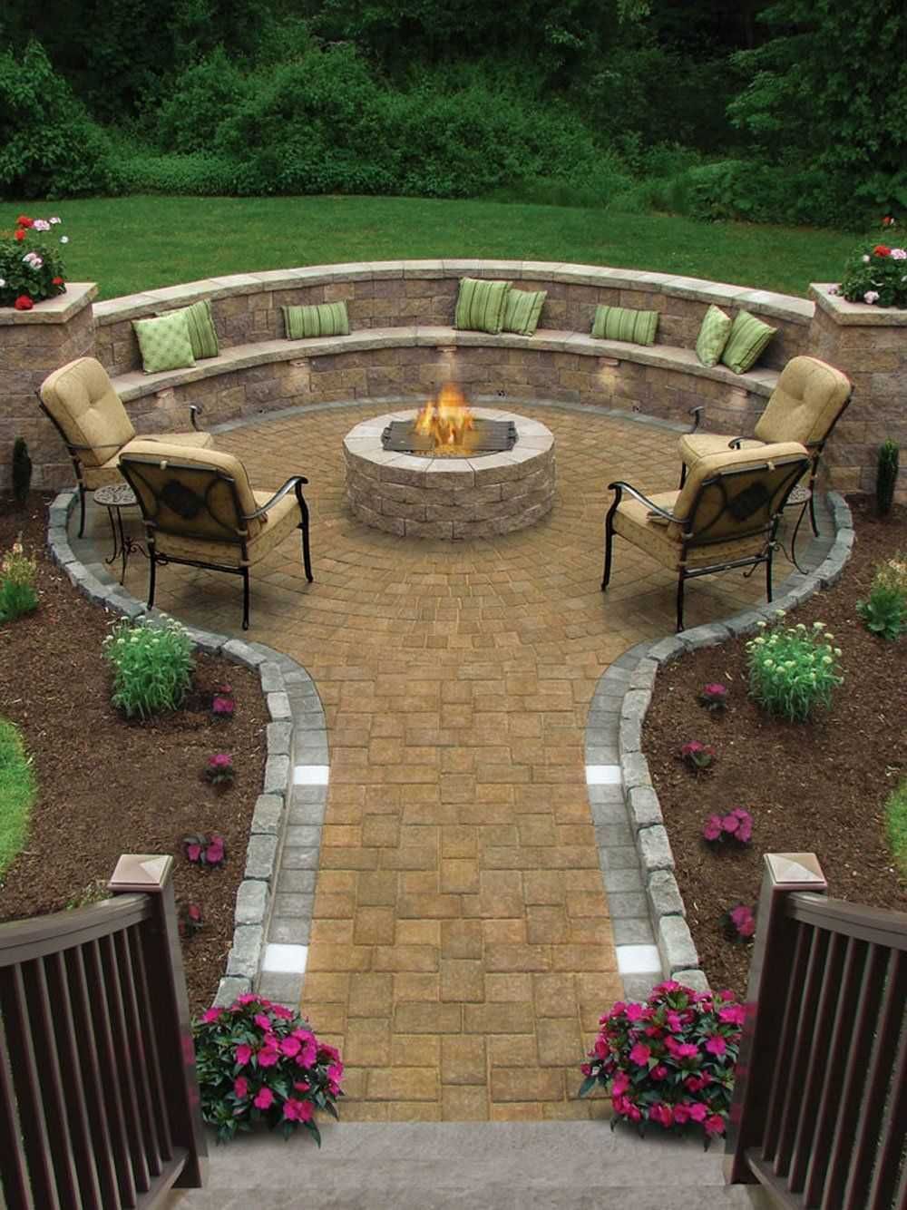 Curved patio with stone fire pit, beige seating, and potted flowers in a landscaped backyard garden.