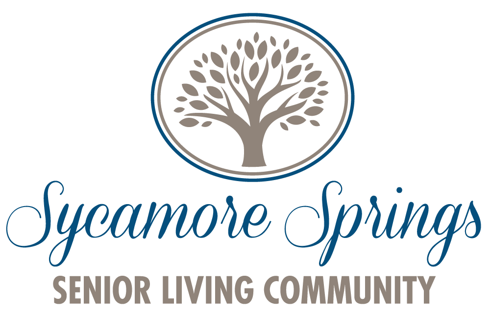 The sycamore springs senior living community logo has a tree in a circle.