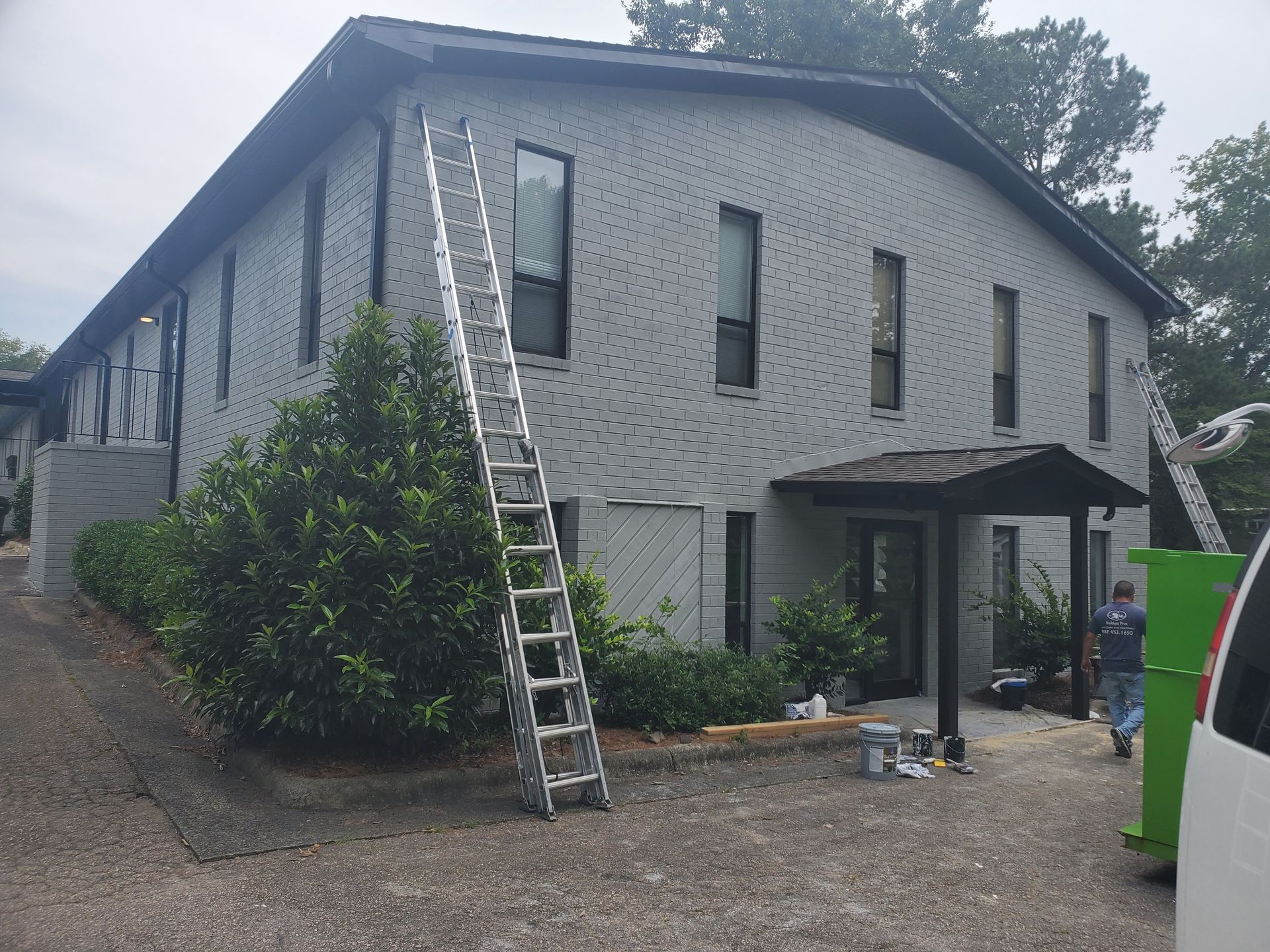 A ladder is leaning against the side of a building