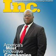 A man in a suit and tie is on the cover of a magazine. A man in a suit and tie is on the cover of a magazine.