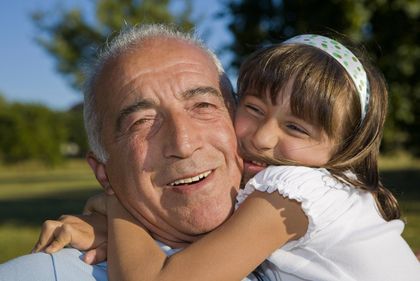 A happy grandfather with his granddaughter