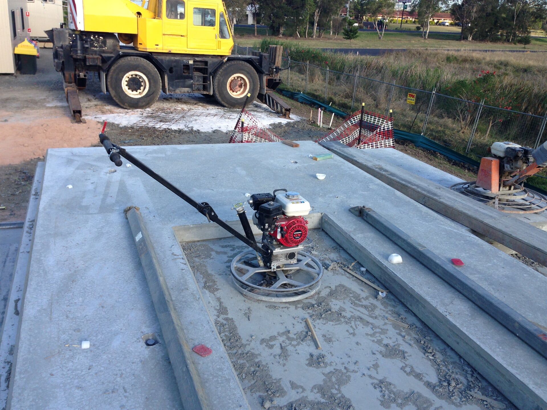 A Concrete slab has set and there is a machine parked in the middle of concrete slab — Wayne Hall Concreting in South Lismore, NSW