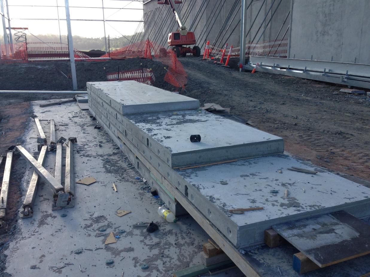 Stack of Concrete Slabs Sitting on Top of Wooden Pallet on a Construction Site — Wayne Hall Concreting in Casino, NSW