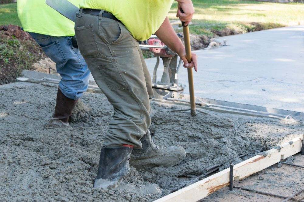 Two Men Are Working on a Concrete Driveway — Wayne Hall Concreting in Kyogle, NSW