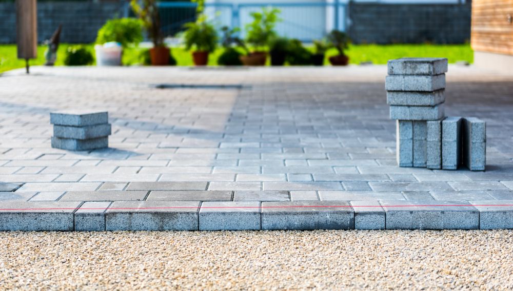 A Brick Walkway is Being Built in a Backyard — Wayne Hall Concreting in Lismore, NSW