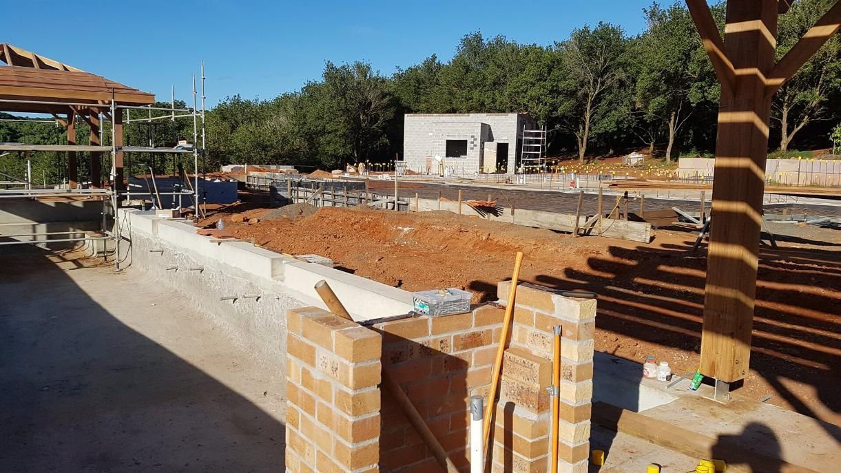 A Construction Site With Bricks and Tools in the Foreground — Wayne Hall Concreting in South Lismore, NSW