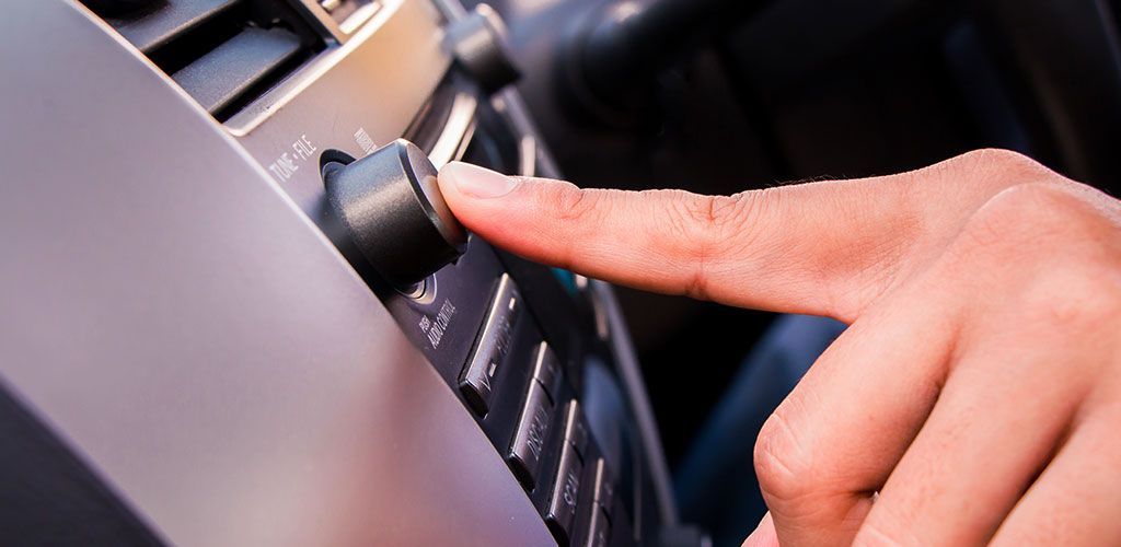 A Person Is Pressing A Button On A Car Air Conditioner β Coffs Harbour Automotive In Coffs Harbour, NSW