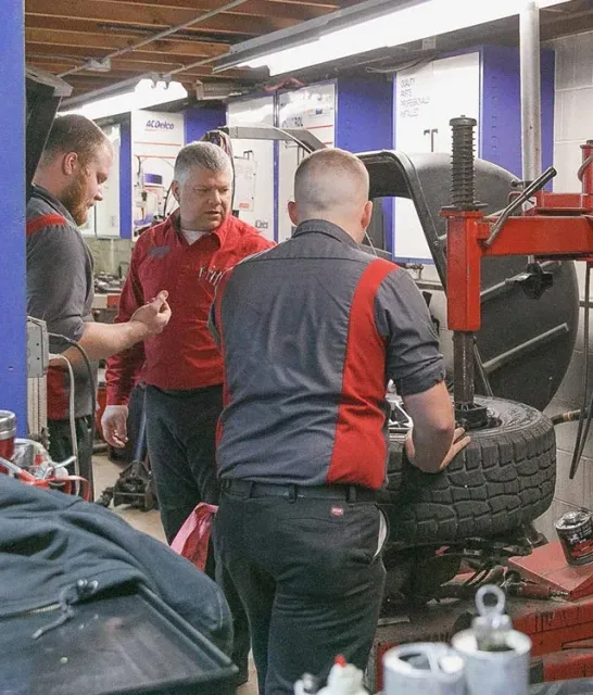 Mechanics work on Wheel Alignment Service | Jamestown Automotive, Inc.