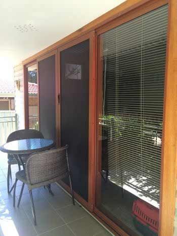 Table and Chairs on the Balcony with a Screen Door - Penrith, NSW - ClearShield-Penrith
