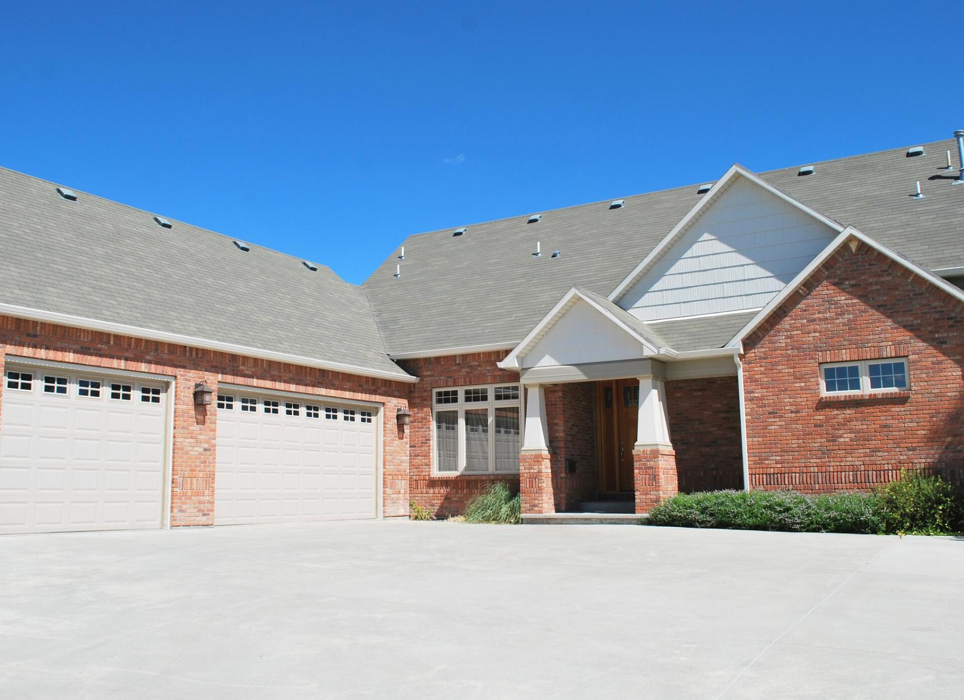 big house with concrete driveway