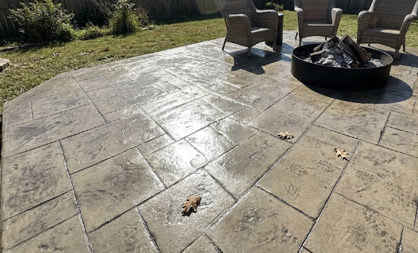 A beautiful stamped concrete patio installation in Columbia MD featuring a natural slate stone pattern.