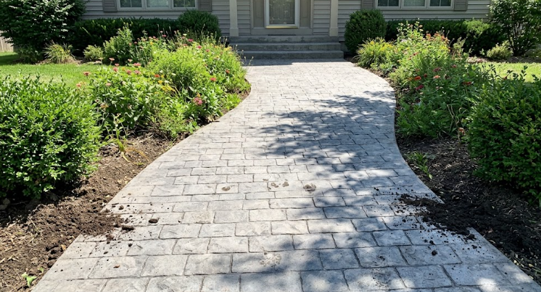 Curved stamped concrete walkway and front steps built for a home in Laurel Maryland.