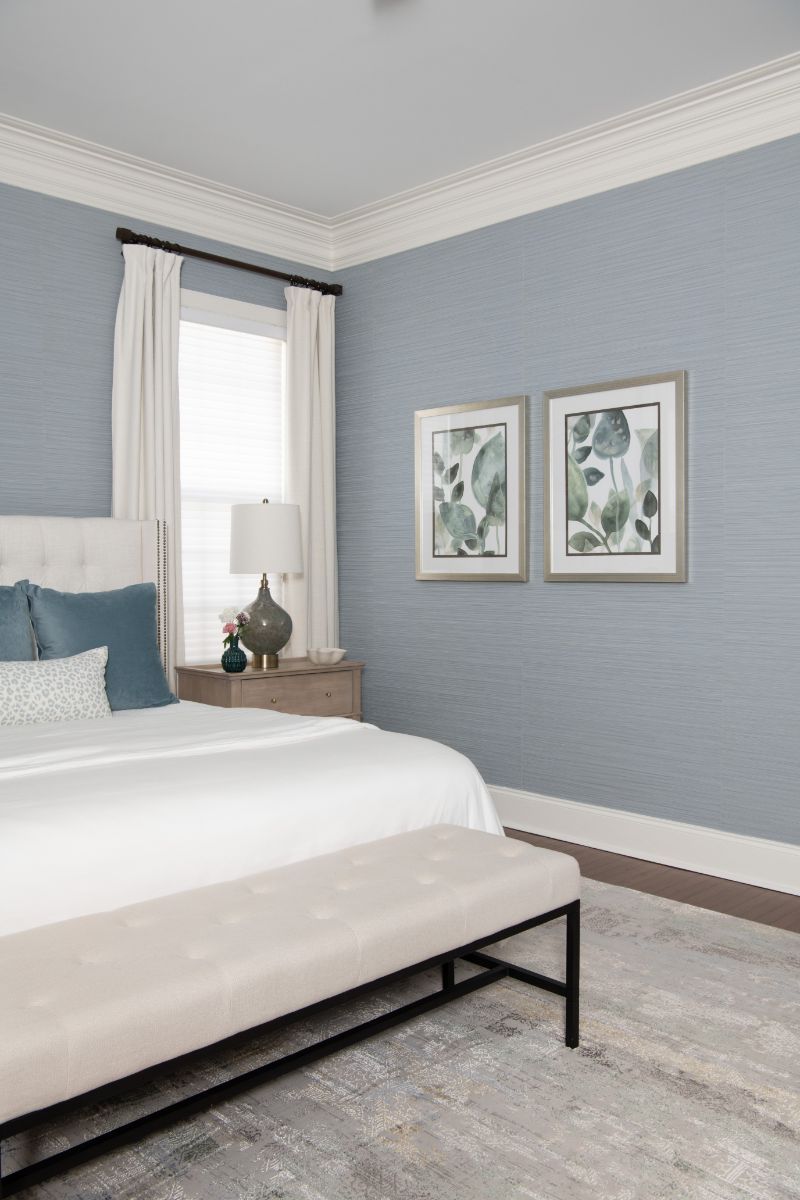 A bedroom with blue walls , a bed , a bench and a window - Charlotte, NC