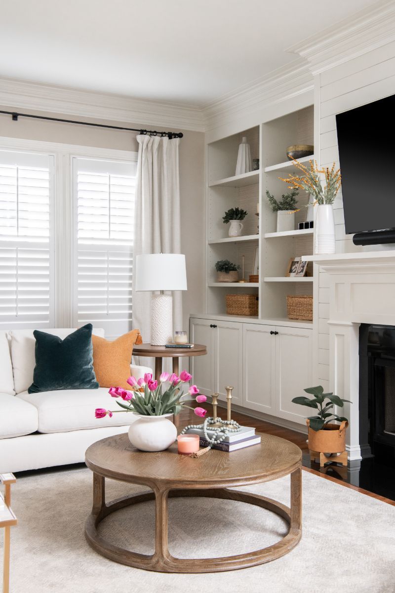 A living room with a couch , coffee table , fireplace and television - Charlotte, NC