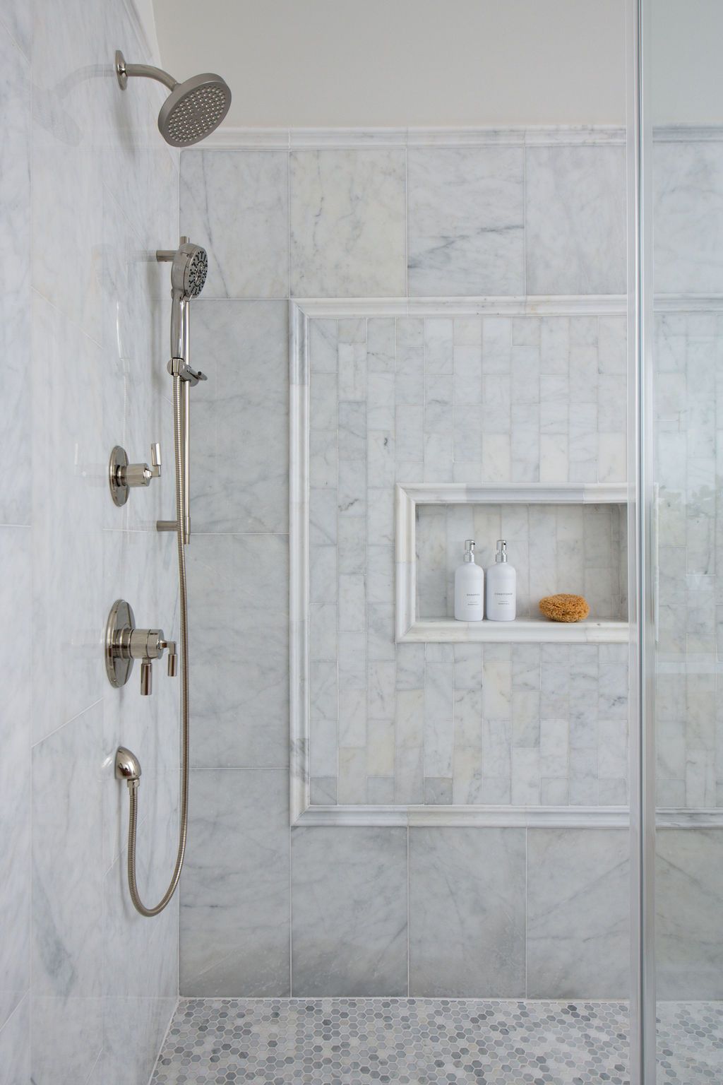 Marble shower with chrome fixtures, built-in shelf, and a rain showerhead - Waxhaw, NC - Kitchen & Family Room Renovation