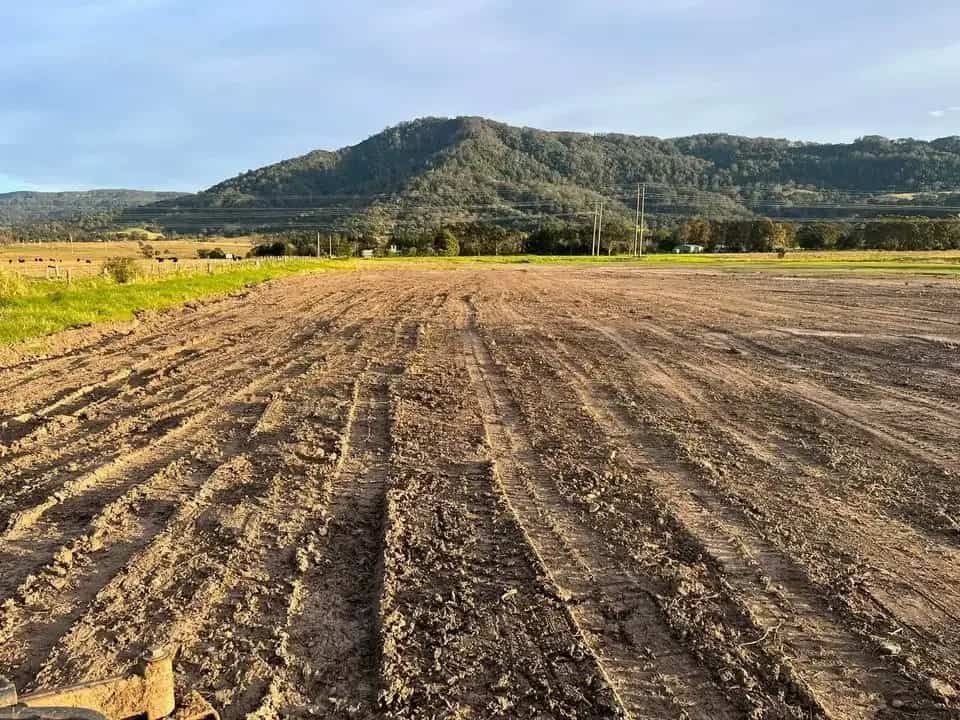 A Dirt Field With a Mountain in the Background — BeCivil in Tomerong, NSW