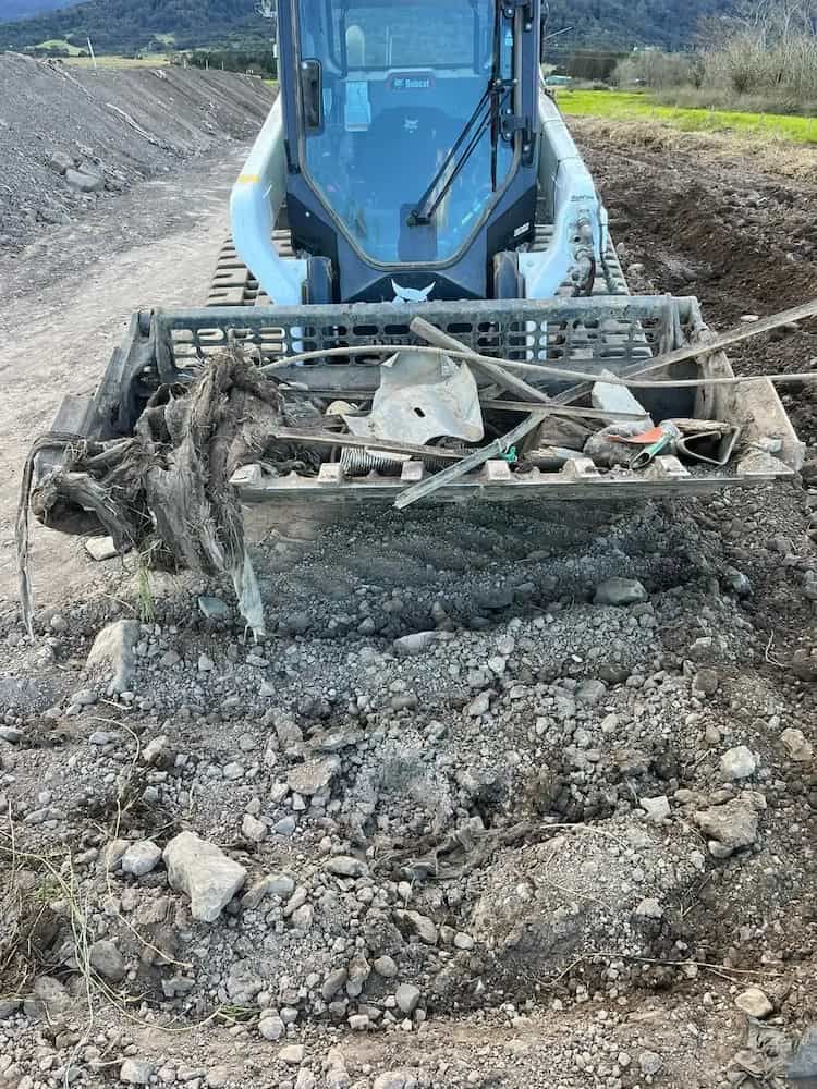 A Bulldozer is Moving Dirt and Rocks on a Dirt Road — BeCivil in Tomerong, NSW