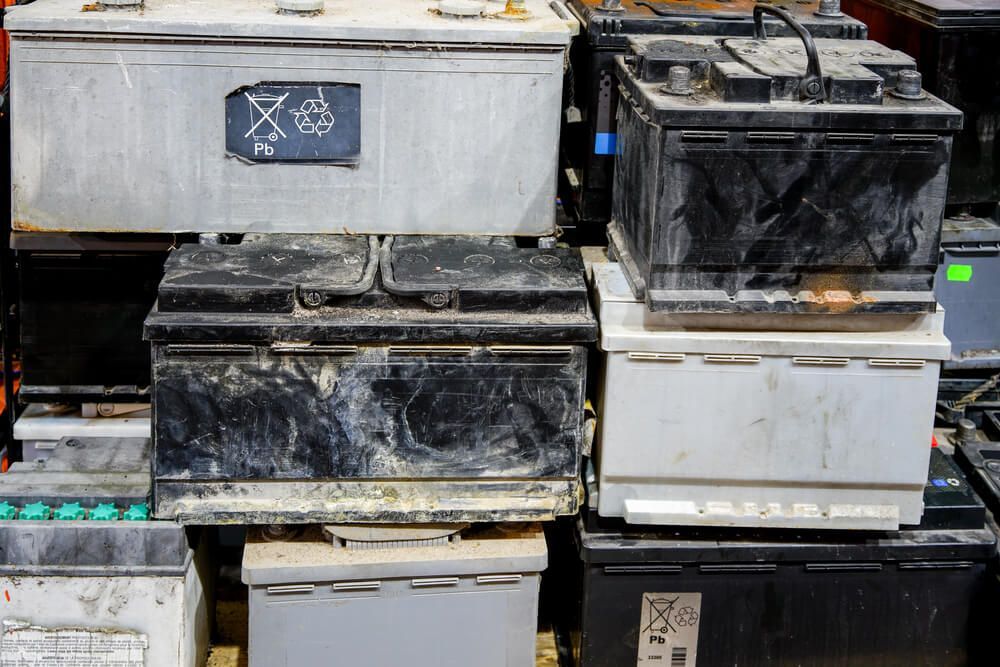 A Bunch Of Batteries Are Stacked On Top Of Each Other For Recycling — Coast 2 Coast Batteries in Kincumber, NSW