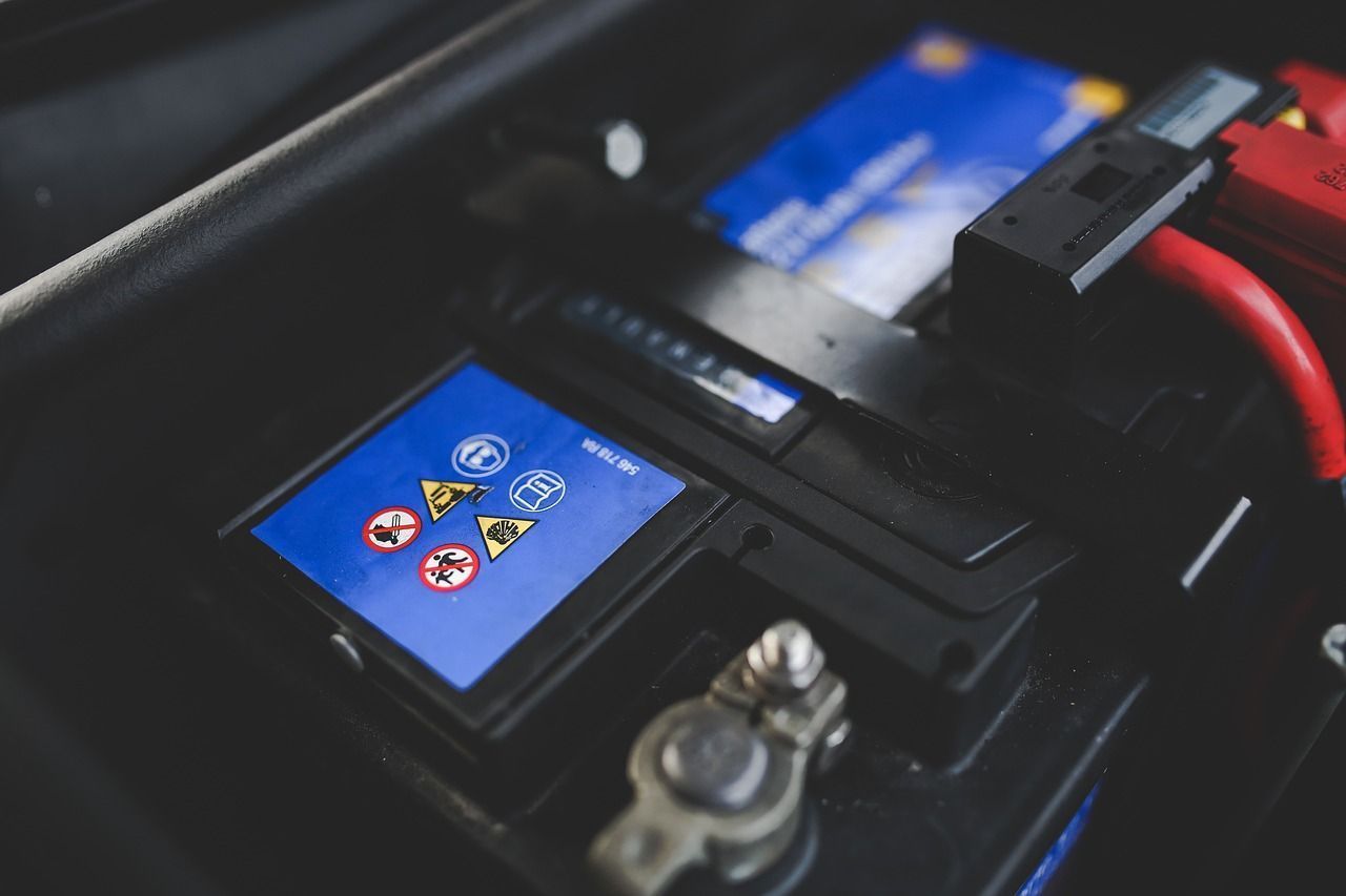 A Close Up Of A Car Battery With A Blue Screen On It — Coast 2 Coast Batteries in West Gosford, NSW