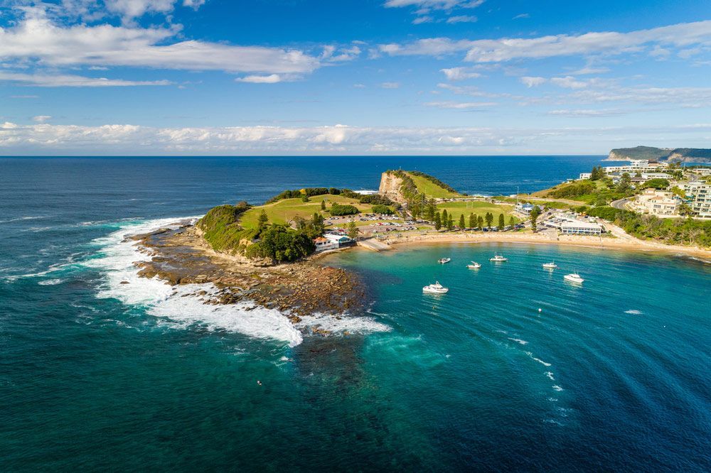 An Aerial View Of A Small Island In The Middle Of The Ocean — Coast 2 Coast Batteries in Terrigal, NSW