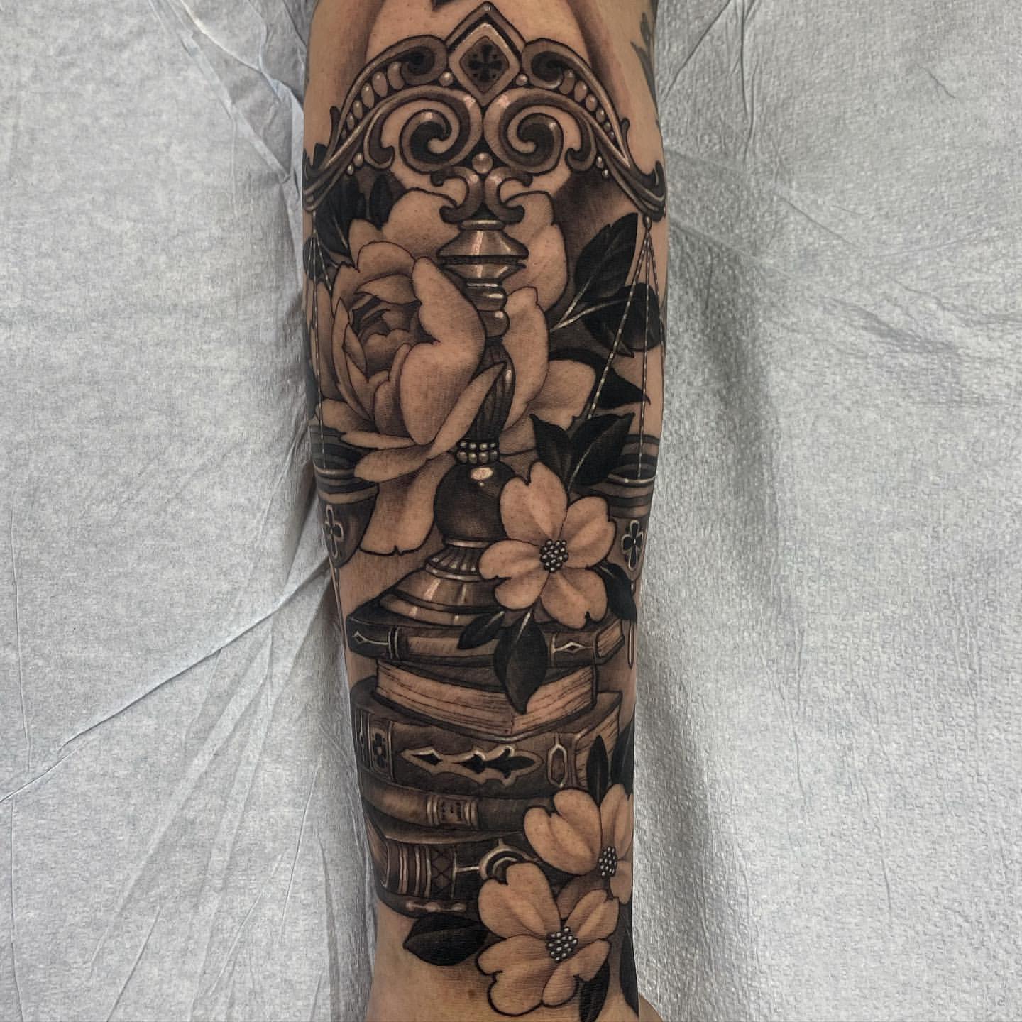 Scale and Books Tattoo by Sasha Day at Black Gold Tattoo Co in Edmonton Alberta Canada