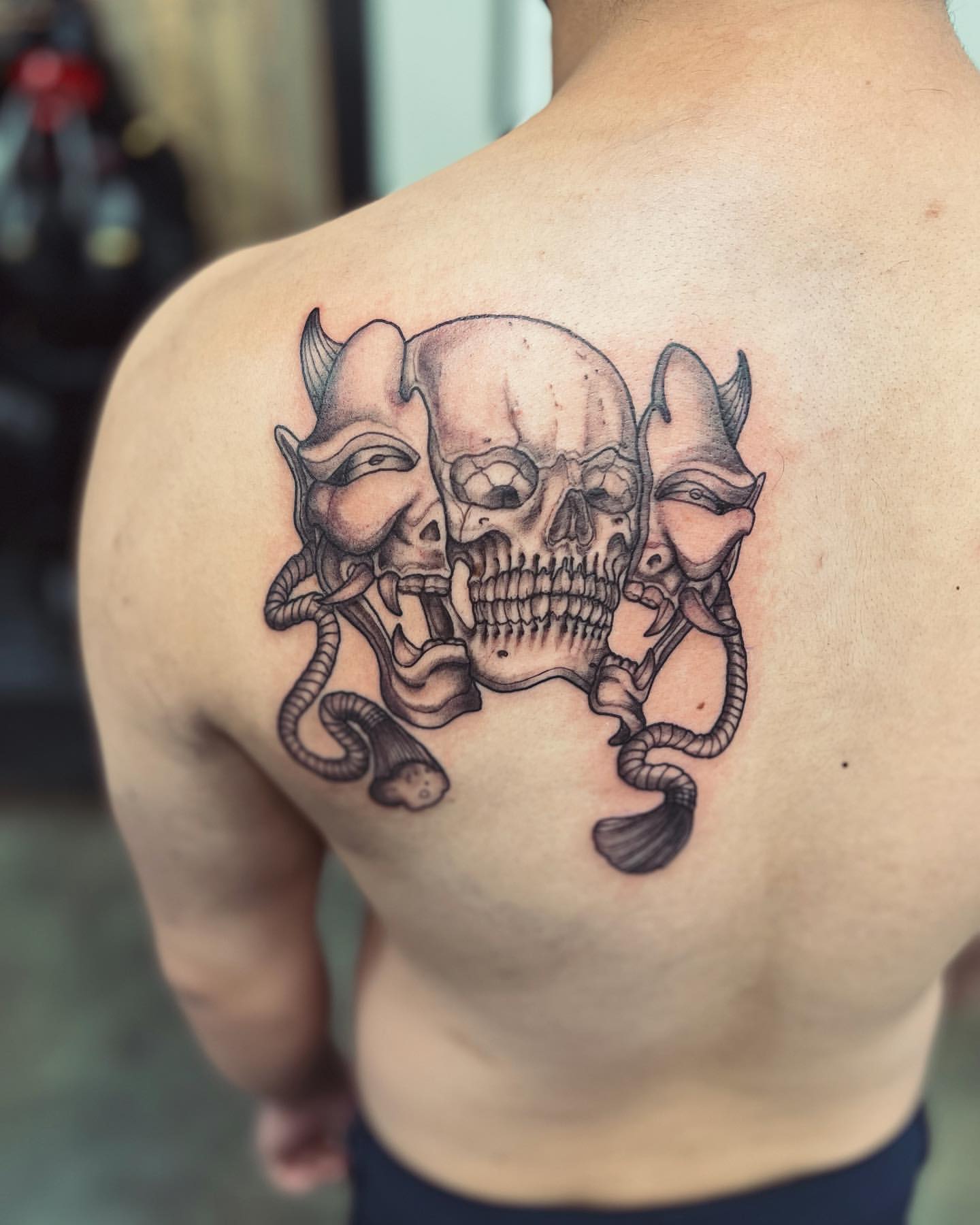 Skull and Split Hannya Mask Tattoo by Vinny Nguyen at Crimson Empire Tattoo in Edmonton Alberta Canada