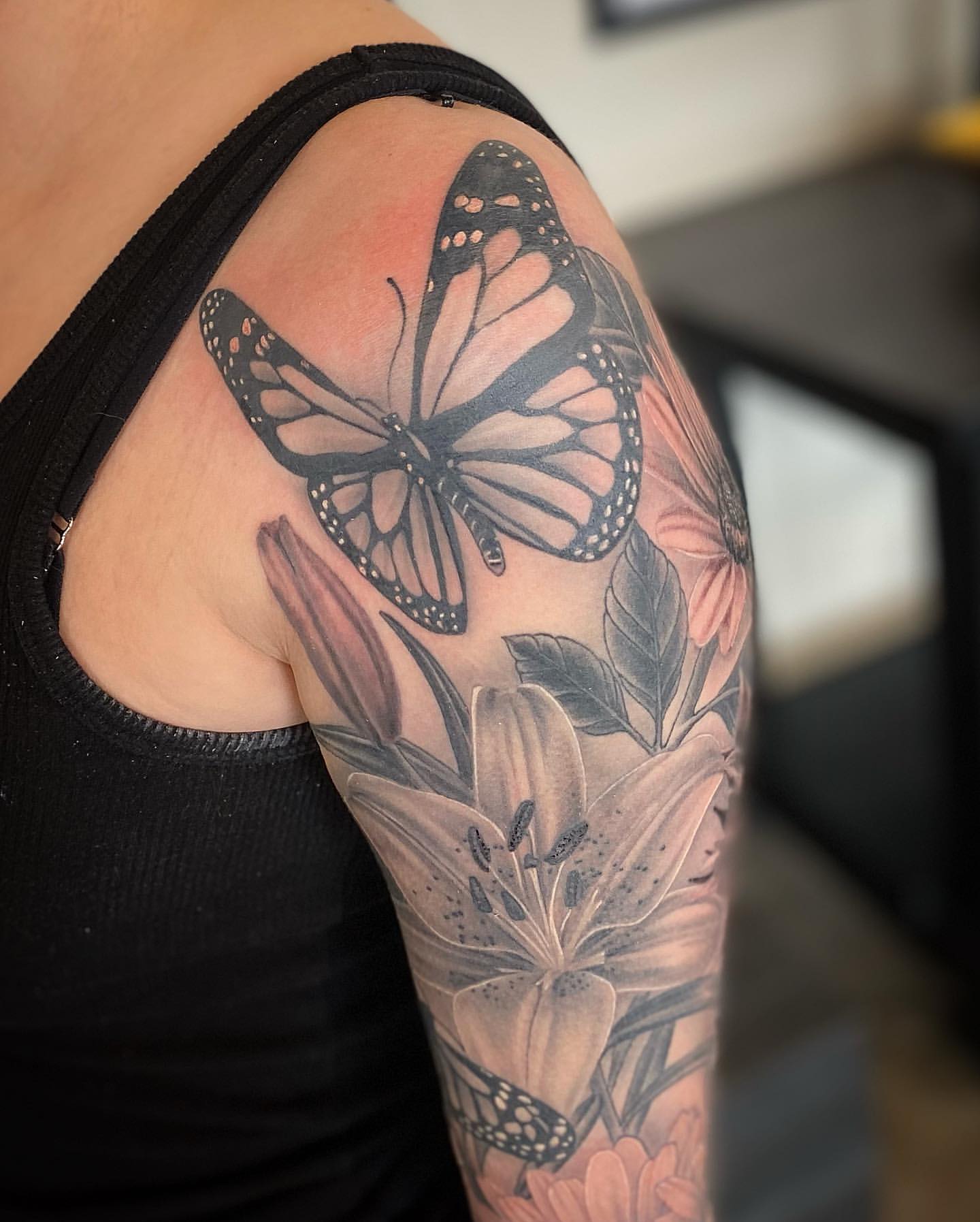 Butterfly and Lilies Tattoo by Dale Moostoos at Crimson Empire Tattoo in Edmonton Alberta Canada