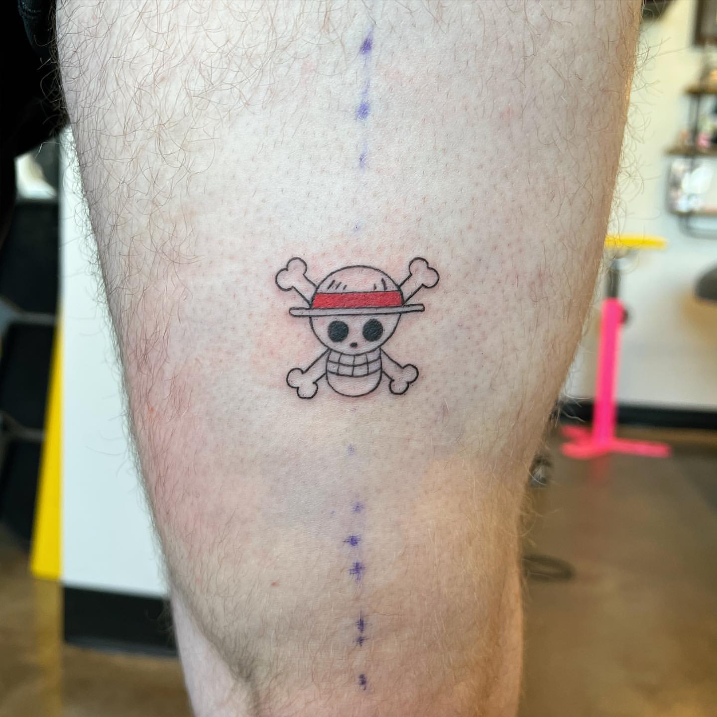 One Piece Logo Tattoo by Vinny Nguyen at Crimson Empire Tattoo in Edmonton Alberta Canada