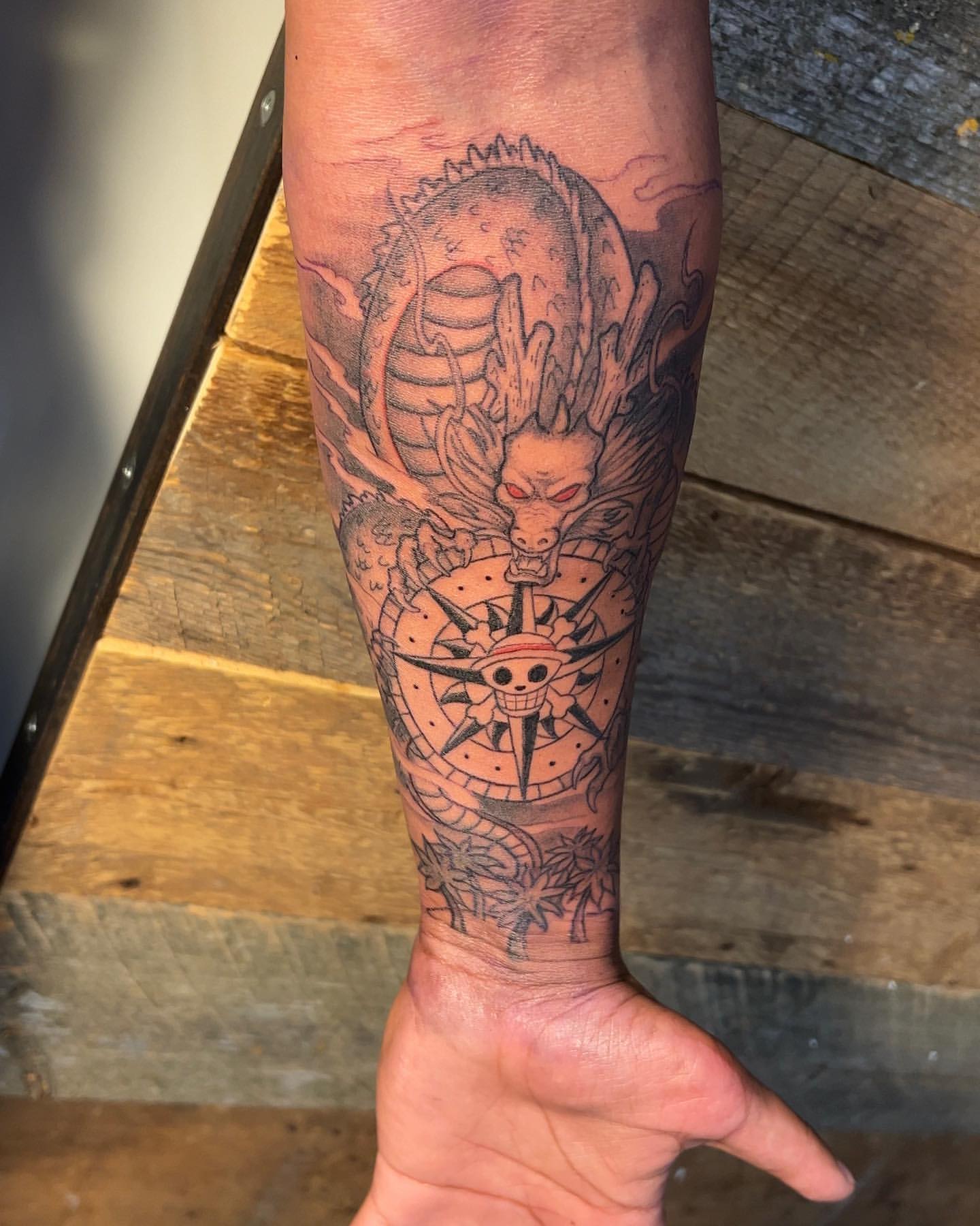 Shenron and One Piece Compass by Vinny Nguyen at Crimson Empire Tattoo in Edmonton Alberta Canada