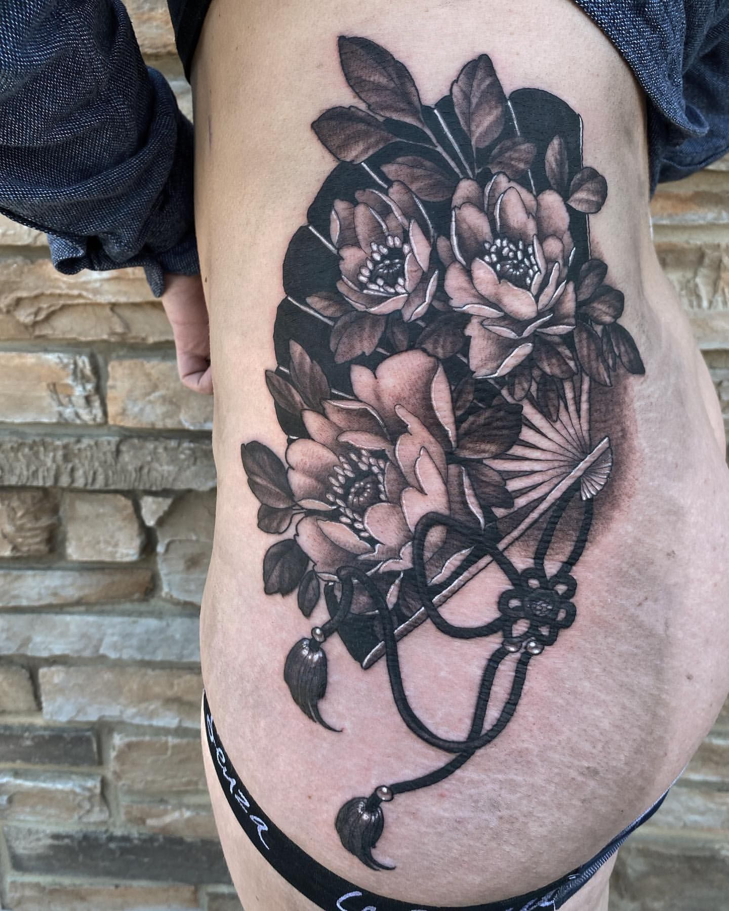 Hand Fan and Floral Tattoo by Sasha Day at Crimson Empire Tattoo in Edmonton Alberta Canada
