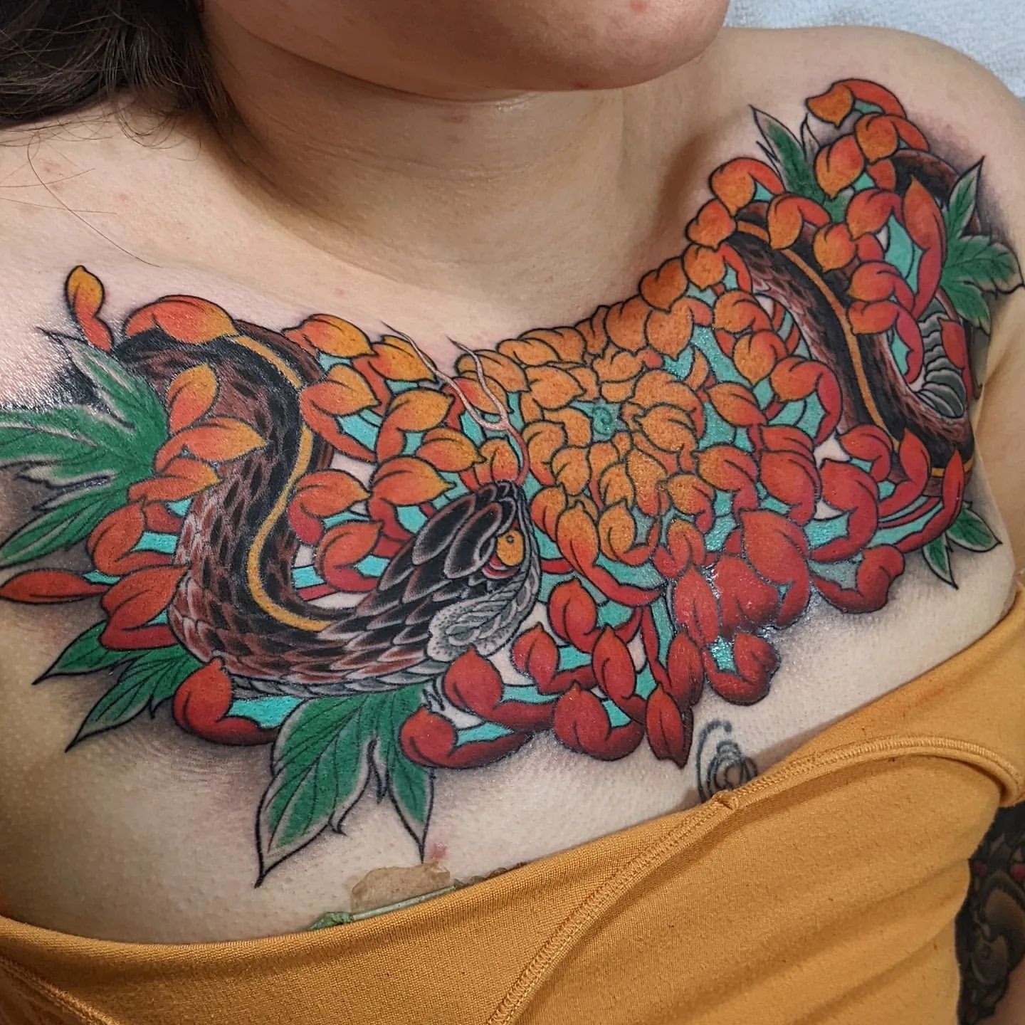 Snakes and Chrysanthemum Chest Tattoo Chris Benson at Silver Ghost Tattoo in Edmonton Alberta Canada