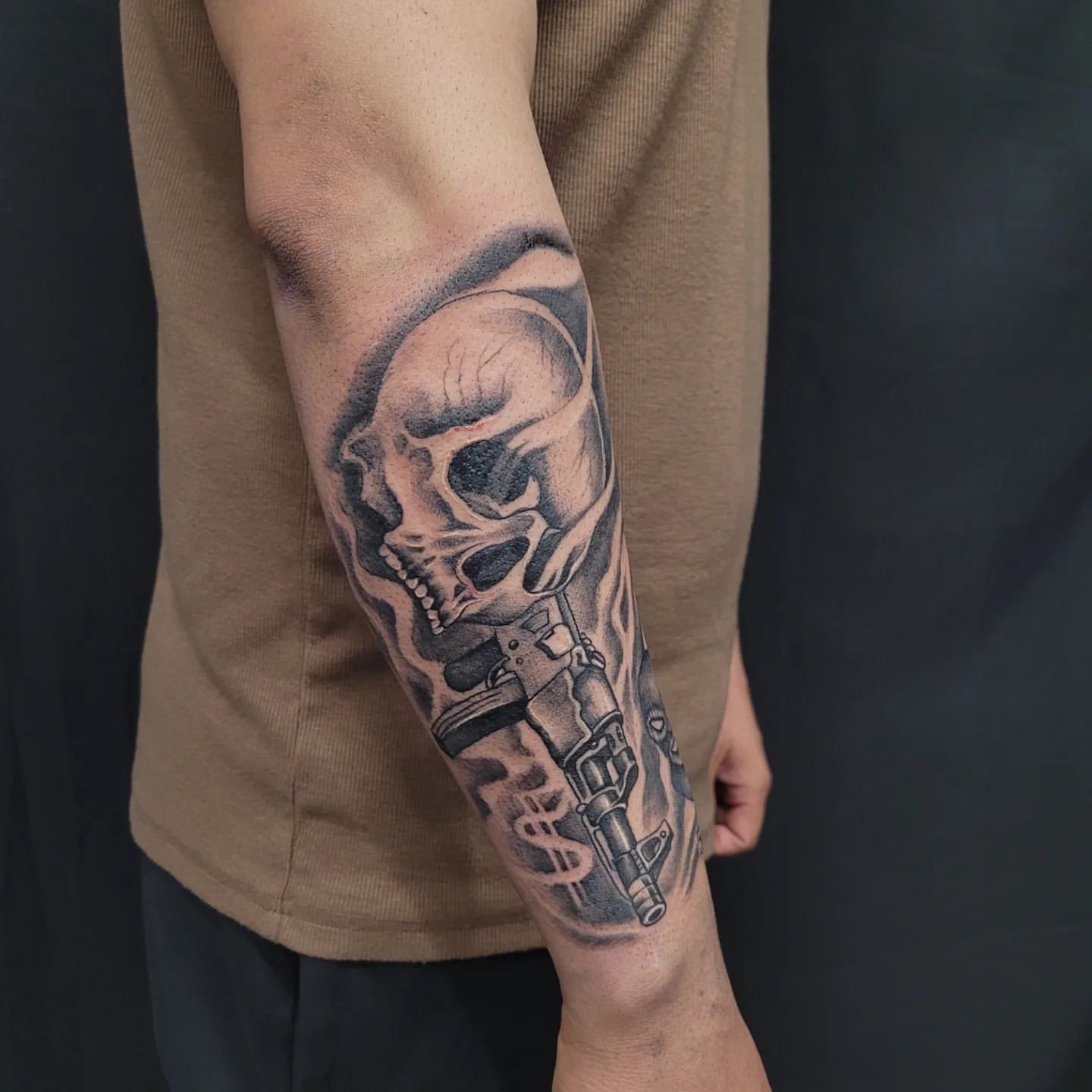 Skull and AK Tattoo by Ian Wang at Black Gold Tattoo Co in Edmonton Alberta Canada